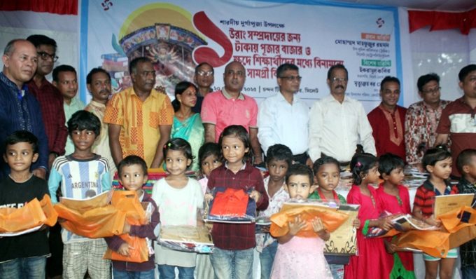 সিলেটে ১ টাকায় পূজার বাজার ও বিনামূল্যে শিক্ষা সামগ্রী বিতরণ
