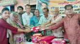 পূজা উদযাপন পরিষদের উদ্যোগে কাষ্টঘরে বস্ত্র বিতরণ